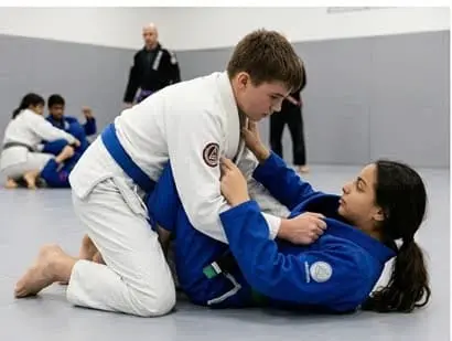 Teen BJJ students practicing guard passing under supervision for BJJ safety for teens