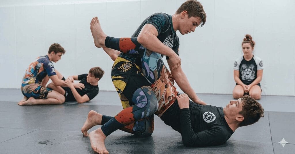Teen students drilling open guard movement for teen grappling fundamentals